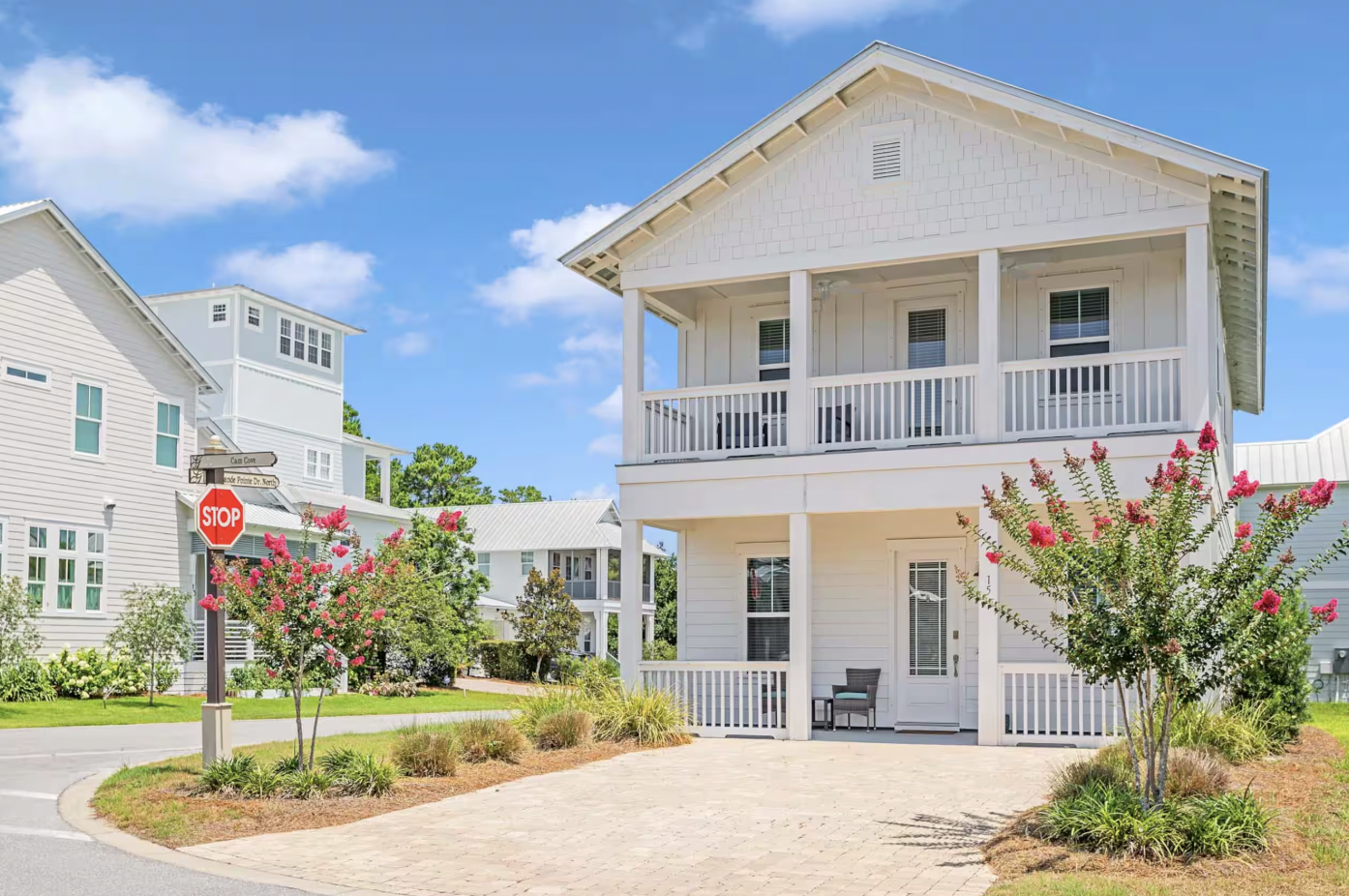15 Cam Cove street view with double porches and flowering trees